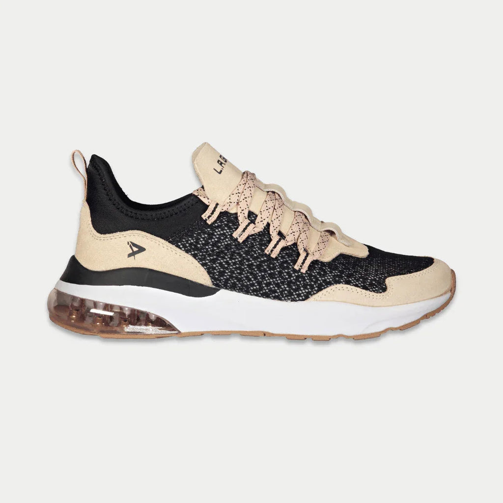 Women’s low-top running sneaker in black, tan, and pink accents with air-cushion sole