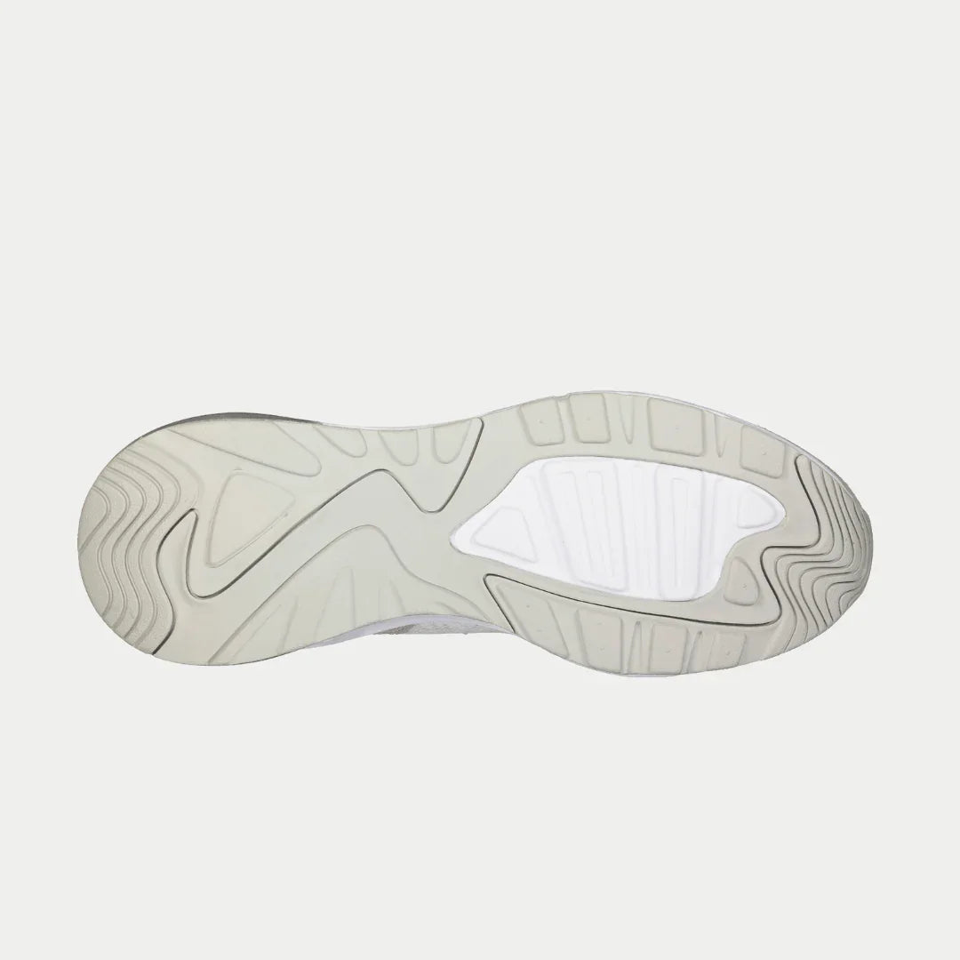 Lowtop sneaker outsole with textured tread and light gray rubber segments