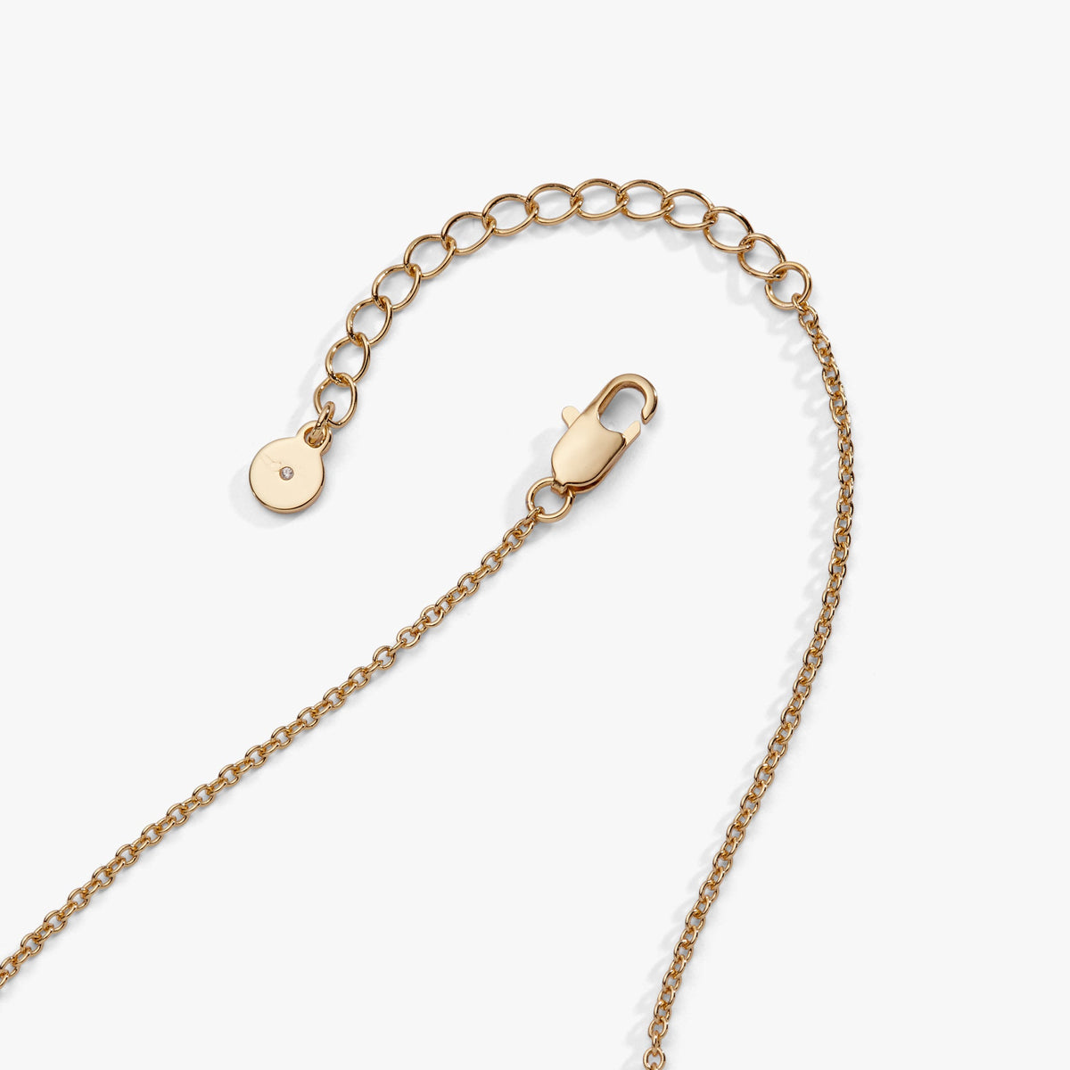 Gold baseball charm necklace with round disc charm and chain detail