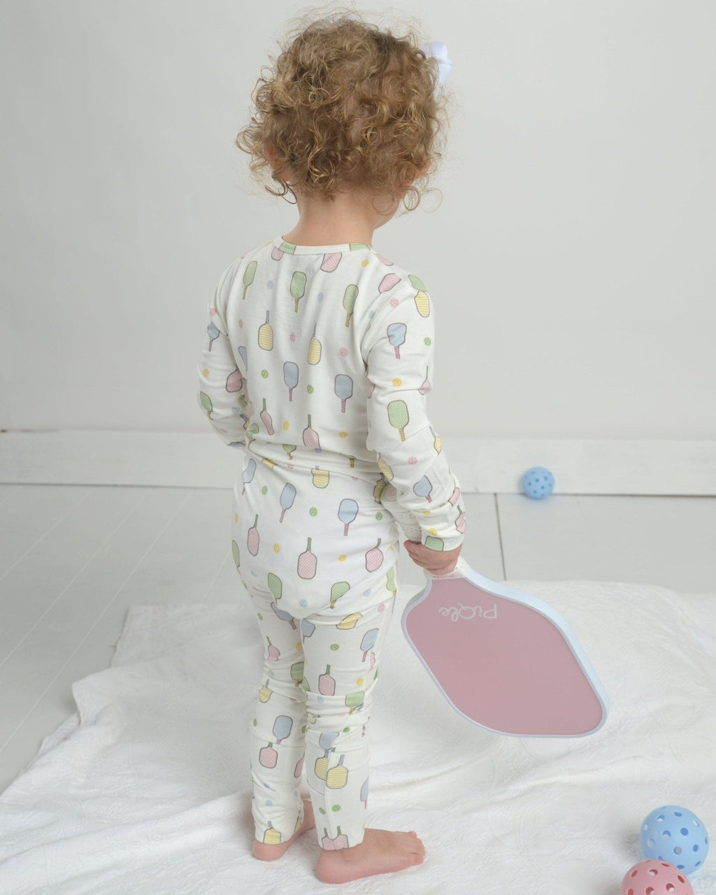 Toddler pajama romper back view in white with colorful popsicle graphic print