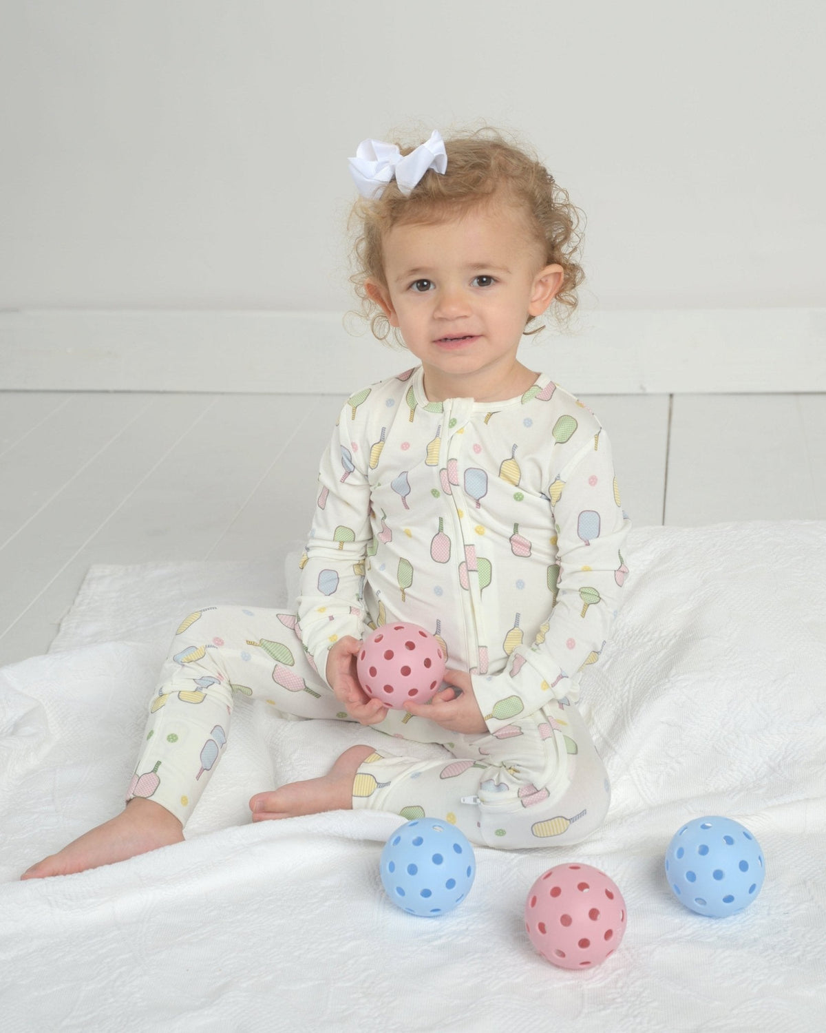 Toddler long-sleeve pajama romper in white with colorful popsicle graphic print
