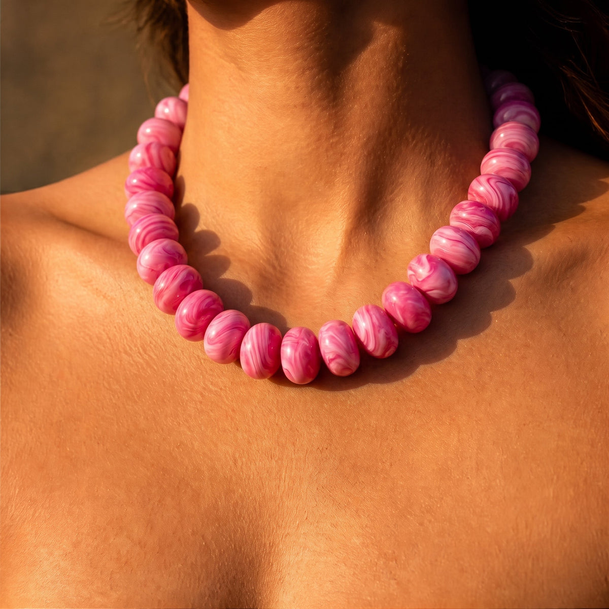 Bubble gum pink beaded necklace with rounded beads and a snug collar fit.