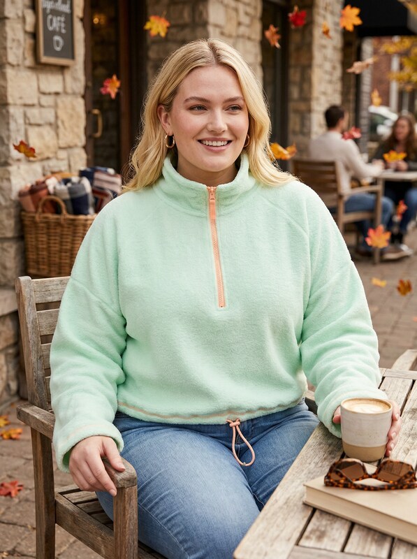 Mint green bungee-hem sweatshirt with half-zip and front drawstring hem.