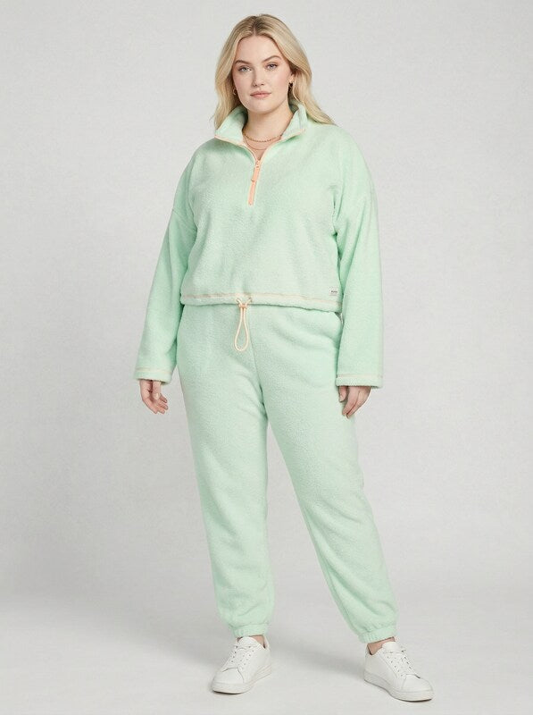 Mint green bungee-hem sweatshirt with half-zip and front drawcord, relaxed fit.