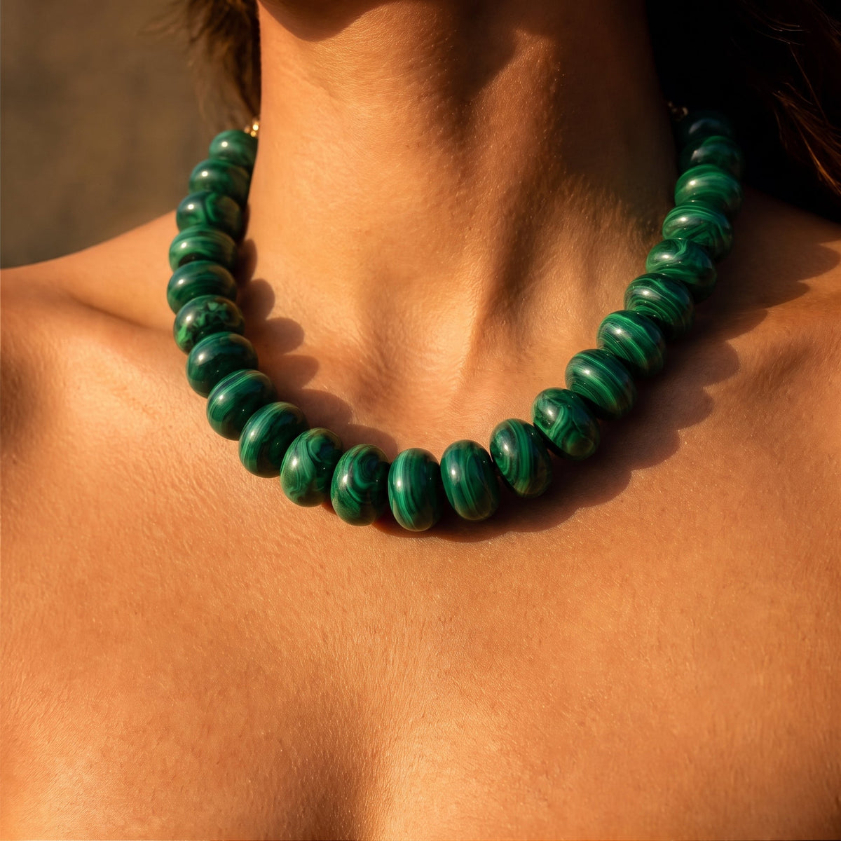 Forest green beaded necklace with rounded beads and a snug collar fit.