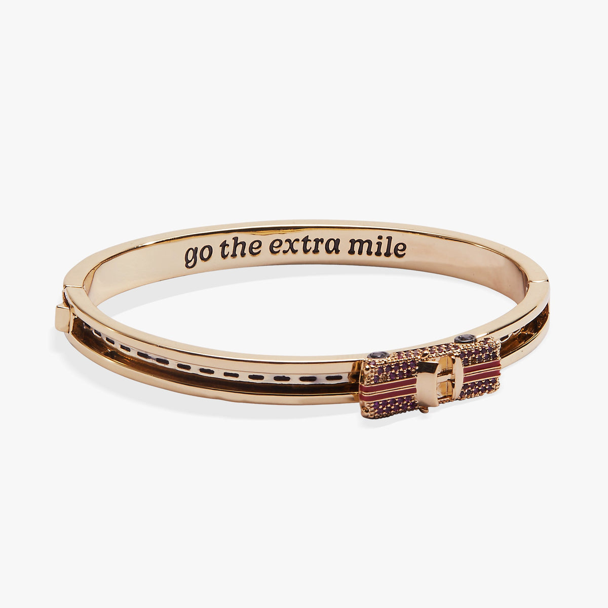 Gold-tone car fidget bangle with pink crystal band and “go the extra mile” text