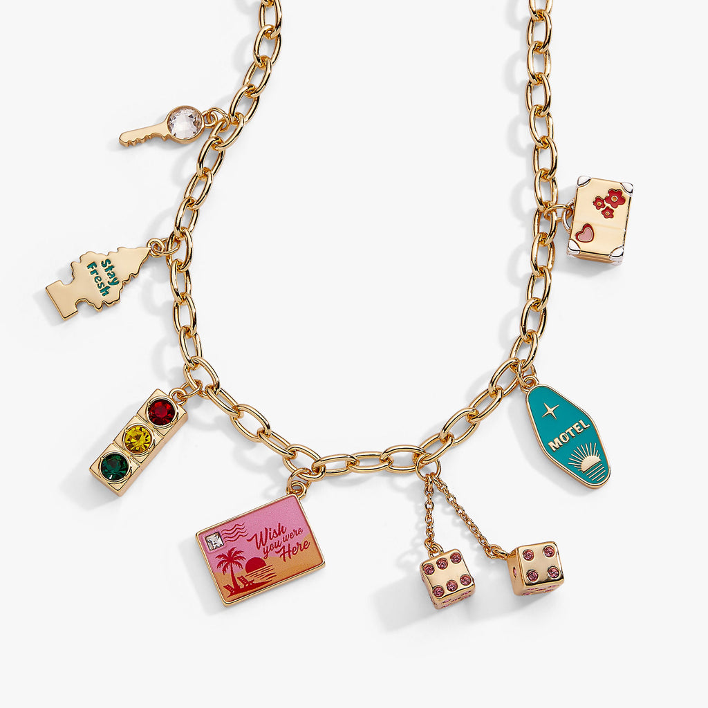 Gold multi-charm necklace with colorful square and bottle-shaped charm pendants