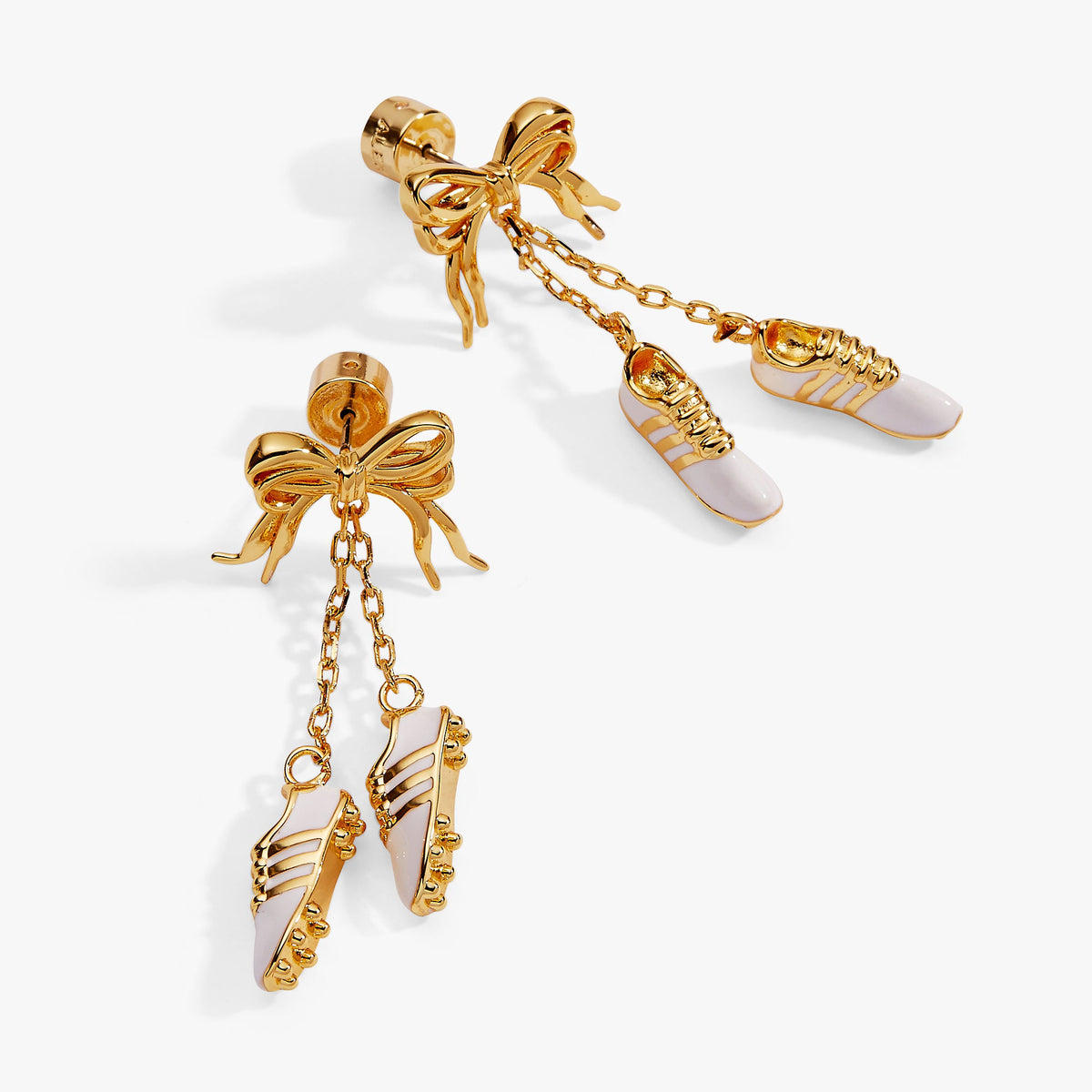 Gold-tone soccer cleat earrings with bow stud backs and long chain dangles