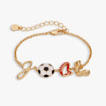 Gold soccer goal bracelet with soccer ball, goal post, red boot, and ring charms on chain