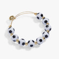 Gold-tone soccer ball beaded bangle bracelet with round black-and-white beads