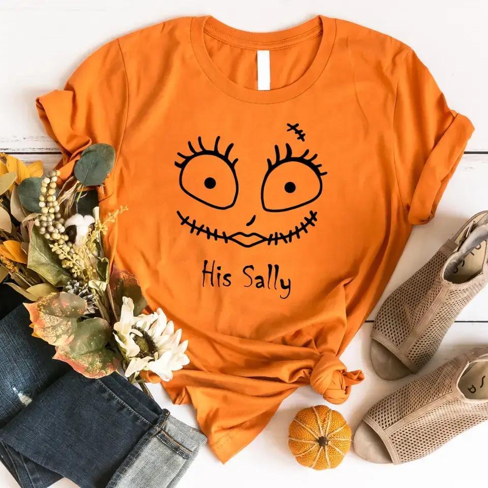 Orange Halloween couples tee with stitched face graphic and 'His Sally' text