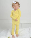 Yellow toddler bamboo romper pajamas with long sleeves and cuffed legs