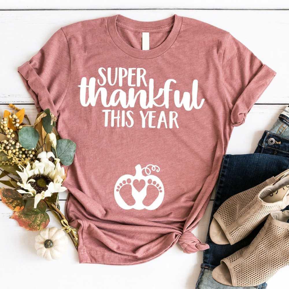 Mauve crewneck tee: 'Super thankful this year' with paw-heart icon, knotted hem
