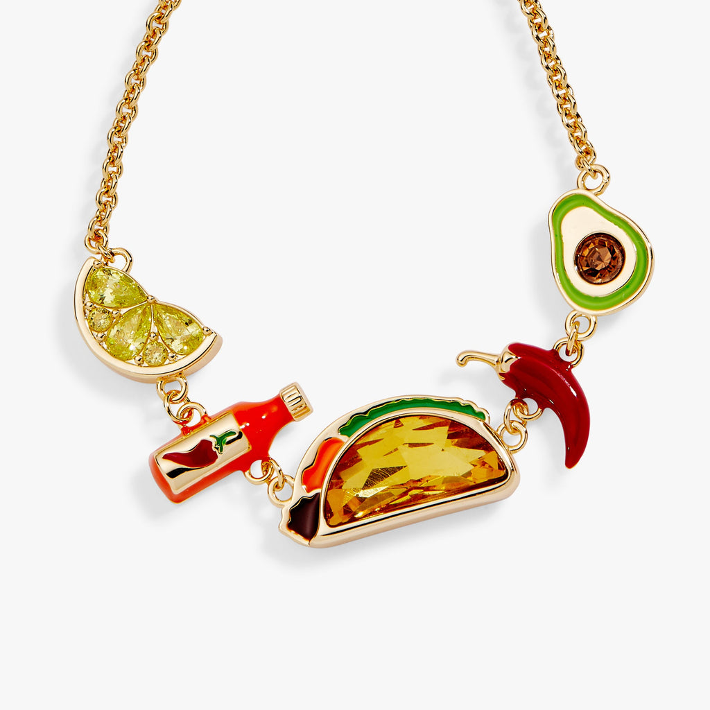 Gold-tone taco bracelet with amber center, green slice charm, and red chili detail
