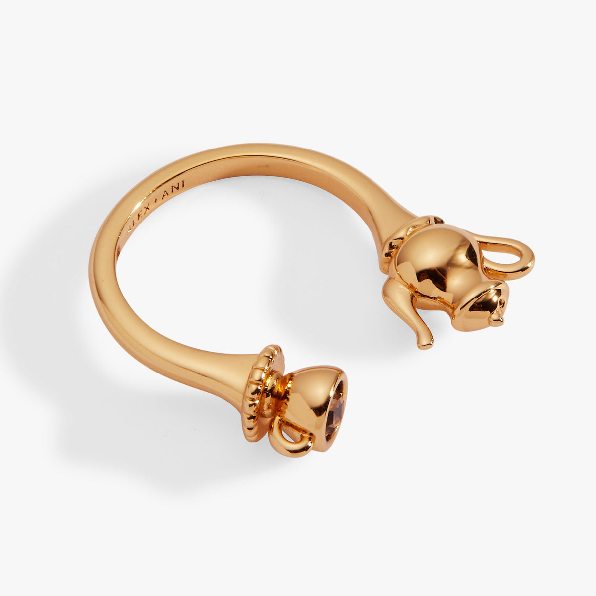 Gold-tone ring with sculpted teapot top and cup charm detail