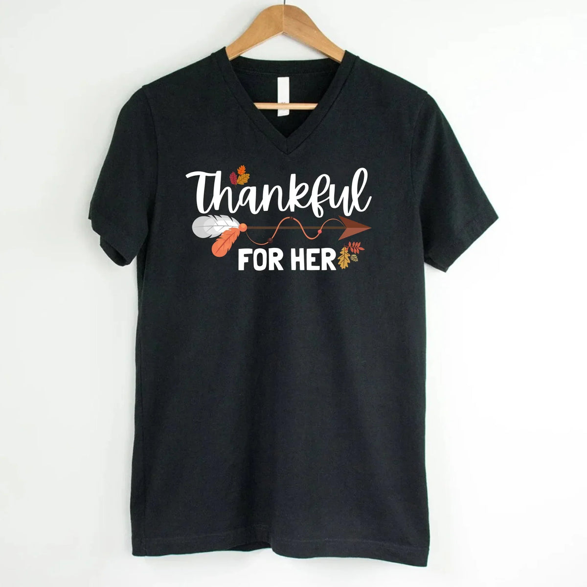 Black v-neck T-shirt with white script 'Thankful for her' and autumn leaf print