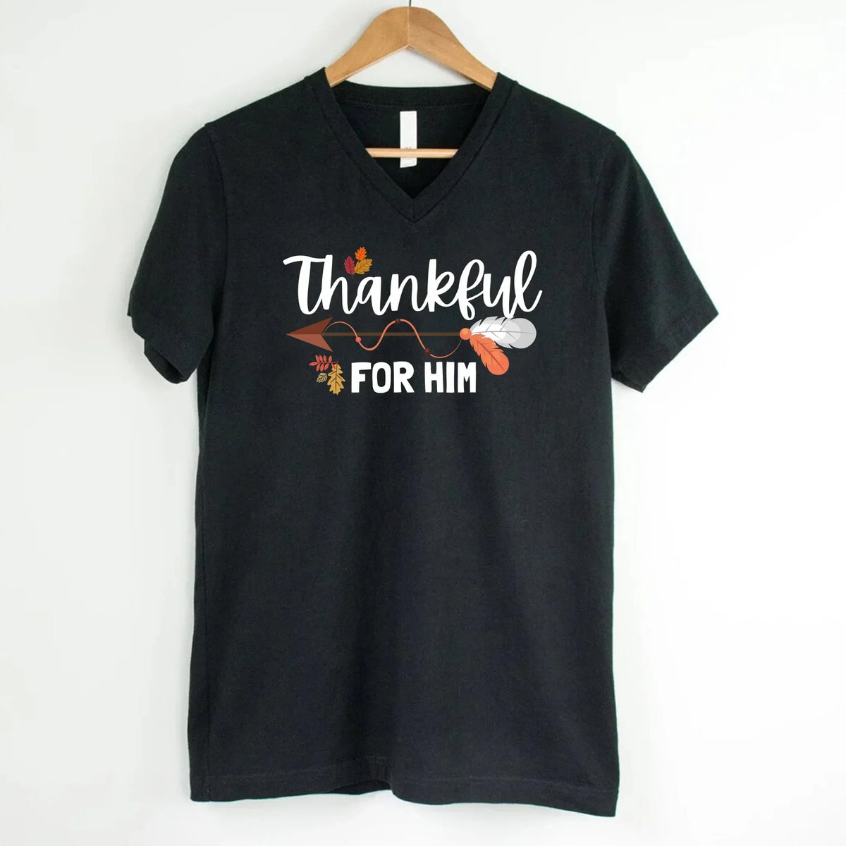 Black v-neck T-shirt with white script 'Thankful for him' and autumn leaf print