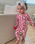 Pink and red checkered toddler pajama romper, long sleeves and full-length legs