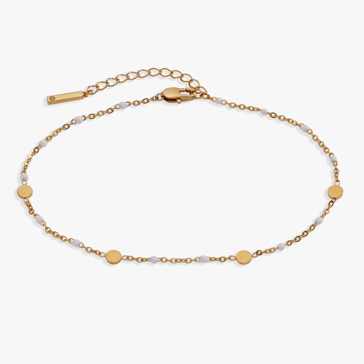 Gold chain anklet with round coin charms and white enamel station links