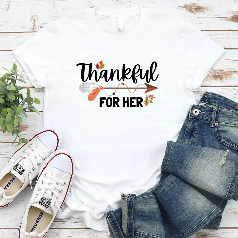White T-shirt with “Thankful” and “FOR HER” holiday graphic print.